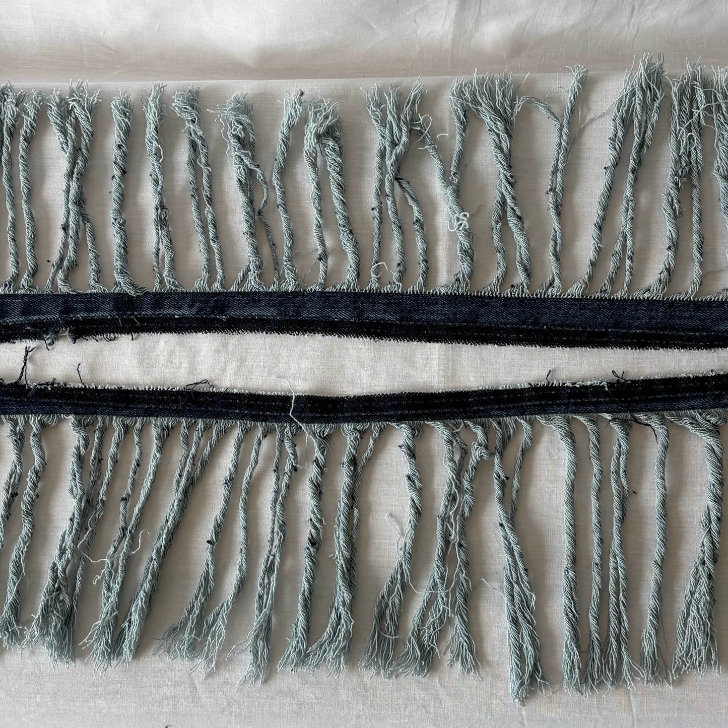 Close up of denim fringe.