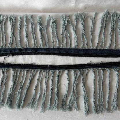 Close up of denim fringe.