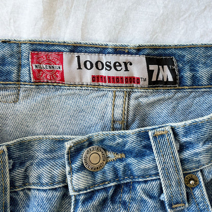 Close-up of a 'looser' jeans label on a denim fabric background