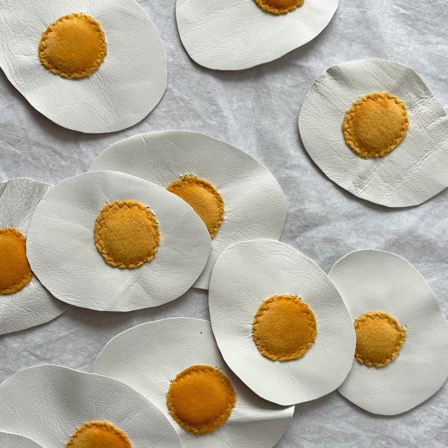 leather and velvet fried egg patches.