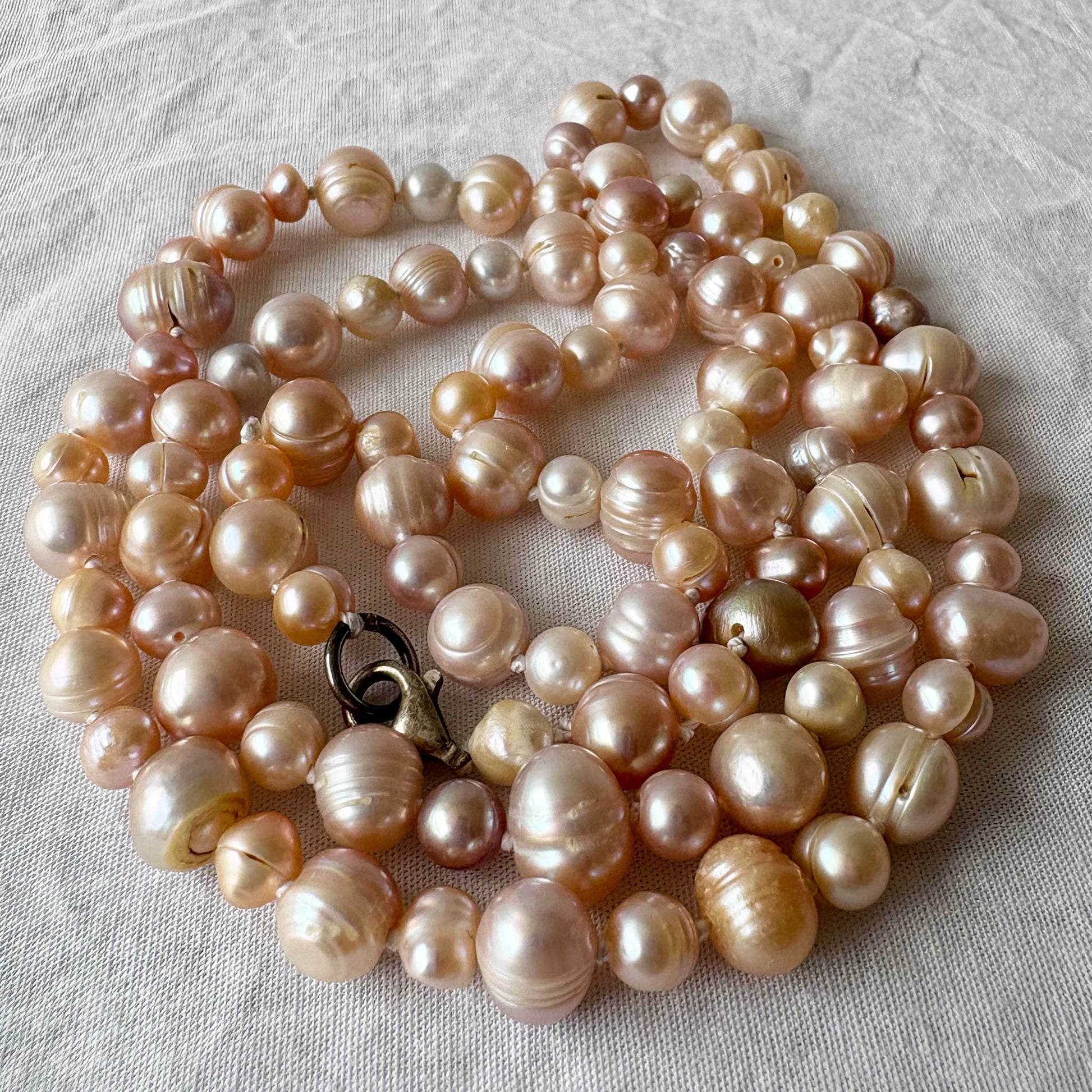 pearl necklace on a light background
