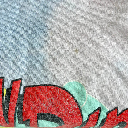 Close-up of  very small very light stain a gray fabric with colorful graphic design